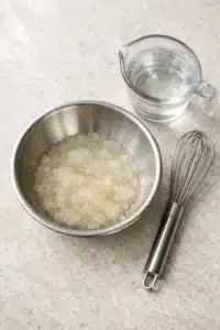 Bariatric Gelatin Trick Recipe: Safe, Sugar-Free, Simple 4 Step-by-step preparation of bariatric gelatin trick recipe in a bowl.